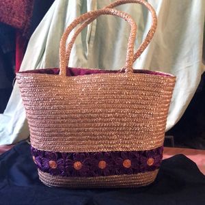 Mambo drawstring and woven straw bag with floral detail